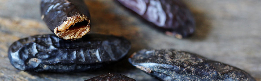 Oriental — tonka beans on a dark table